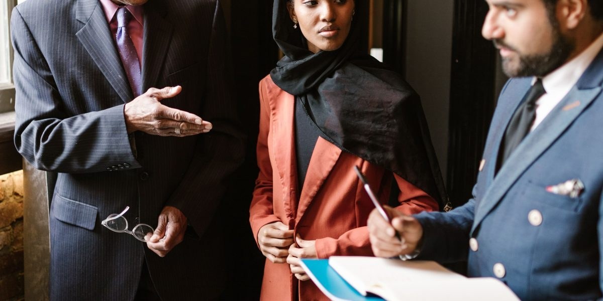 Professional advisor discussing property plans with investors