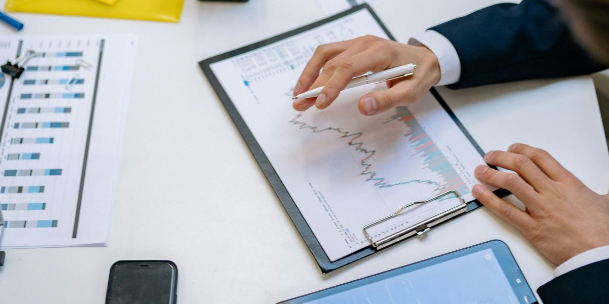 Professionals engaging in strategic discussions, analyzing market trends to make informed investment decisions.