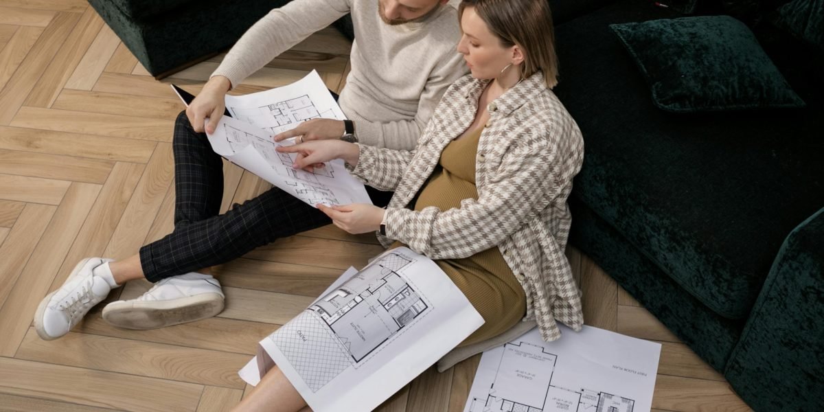 A couple discusses their future home investment, considering space, privacy, and community features.
