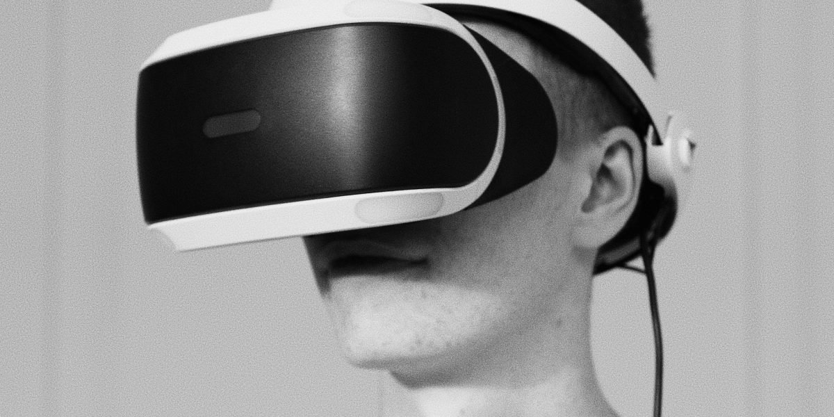 An individual uses virtual reality to experience a property remotely, enhancing decision-making.