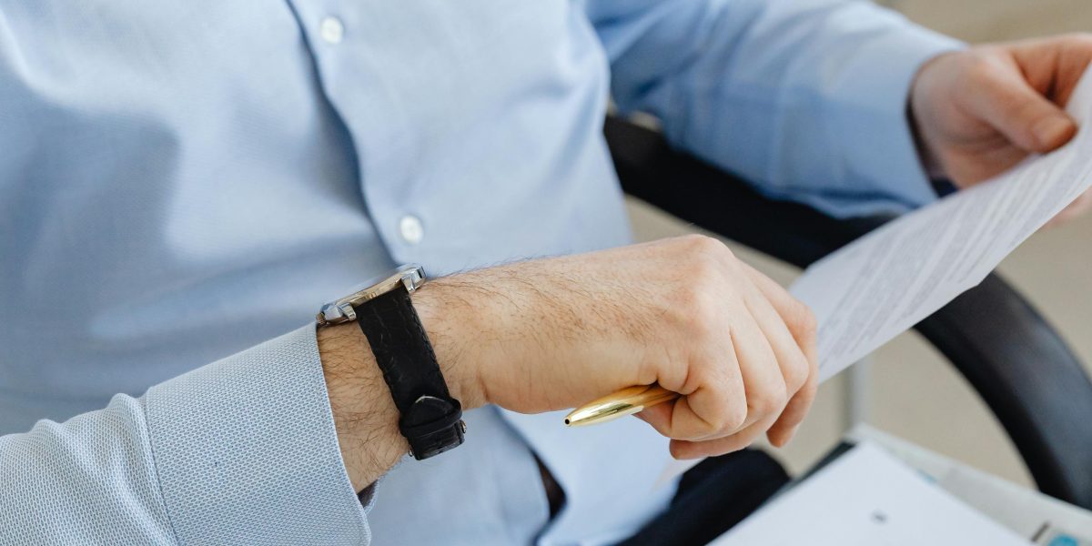 An investor carefully reviews documents and data, making an informed decision before committing to a real estate platform.