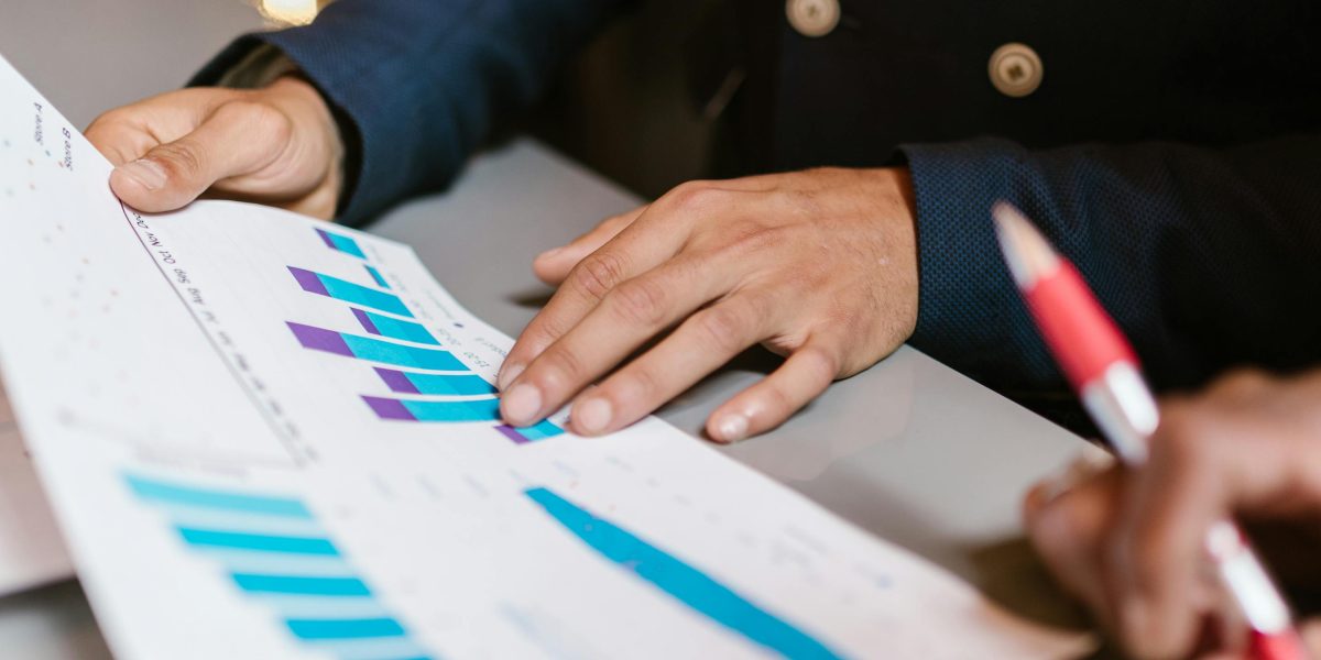 A thoughtful investor reviewing documents, symbolizing the important decision-making process in real estate.