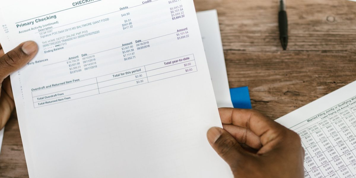 An investor meticulously reviews financial reports to optimize their Dubai property portfolio.