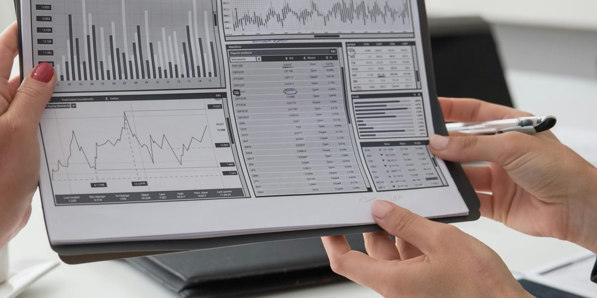 A professional meticulously examining financial data and reports.