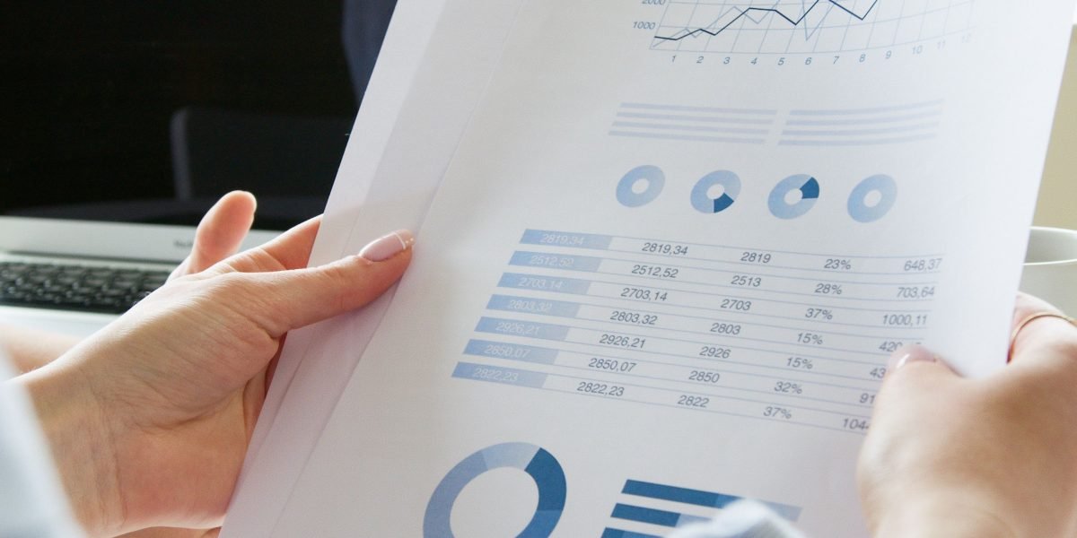 An individual focused intently on data, symbolizing the thorough research needed for market insights.