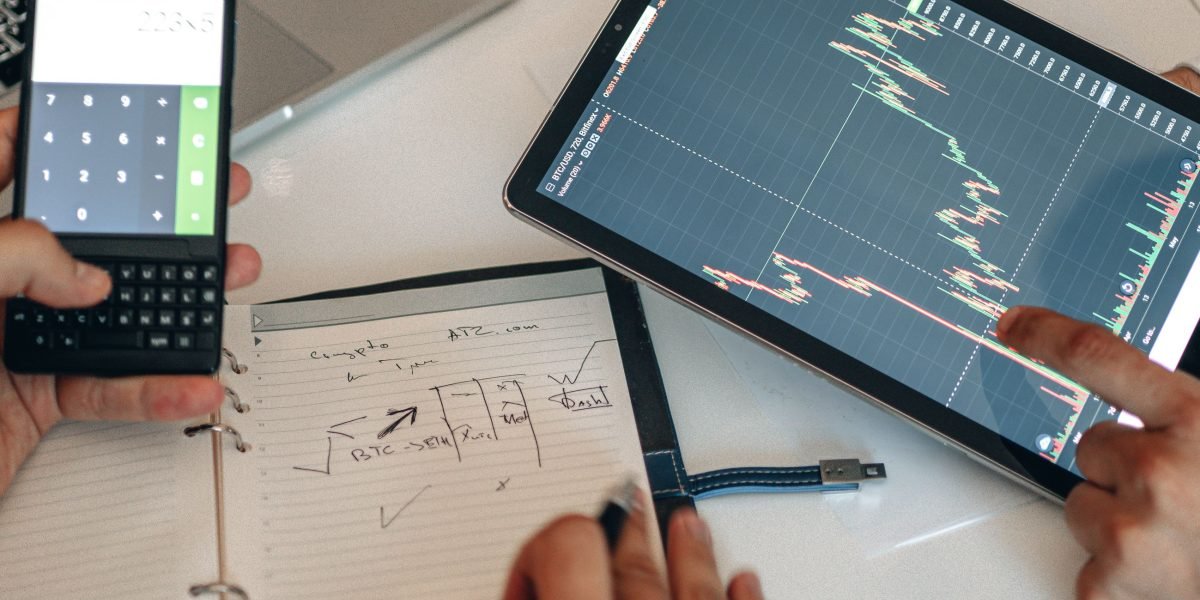 An individual intently reviewing charts and data, reflecting the data-driven approach to identifying top investment areas.