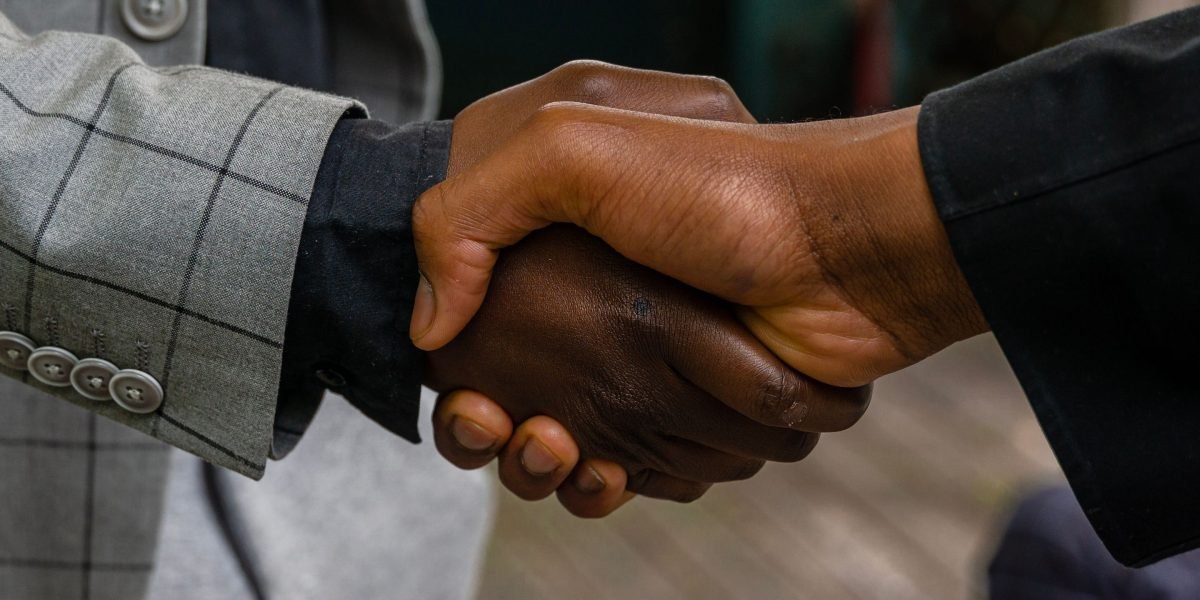A real estate professional consulting with a client, emphasizing the importance of trust in property investment decisions.