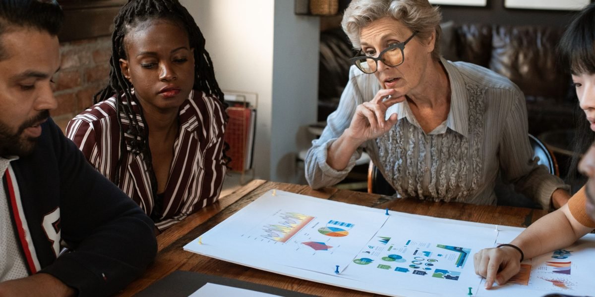 A team discussing market insights, highlighting the importance of local knowledge in real estate.