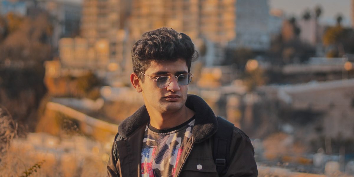 A person looks confidently at a city skyline, symbolizing a well-informed decision in a complex market.