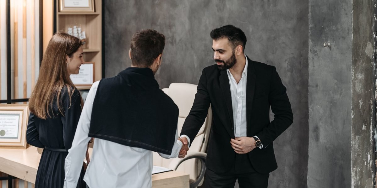 A professional real estate expert offering personalized guidance to a client on property investment in Dubai.
