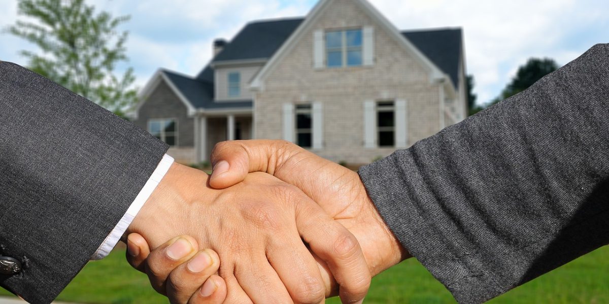 An expert guiding a client through community options within Dubai Hills Estate.