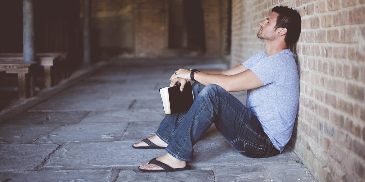 A person thoughtfully considering various investment opportunities or financial plans.