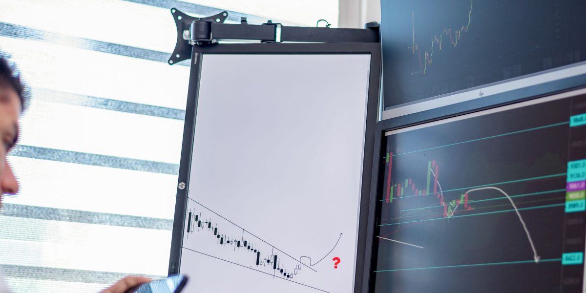 An investor confidently analyzes financial charts, making informed decisions based on market signals.