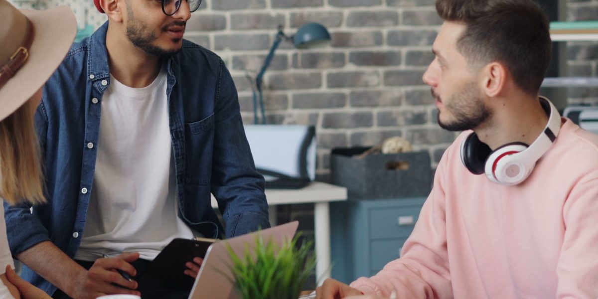 Professionals in a modern office collaborating, symbolizing a thriving economy and growth.