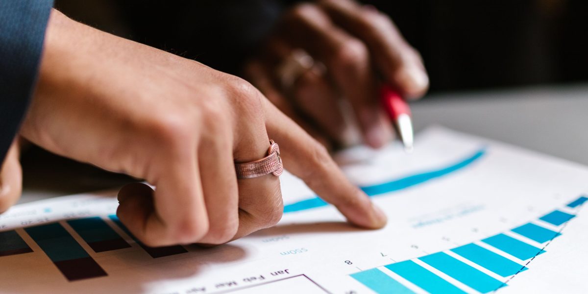 Professionals analyzing market data to identify key real estate trends and opportunities.