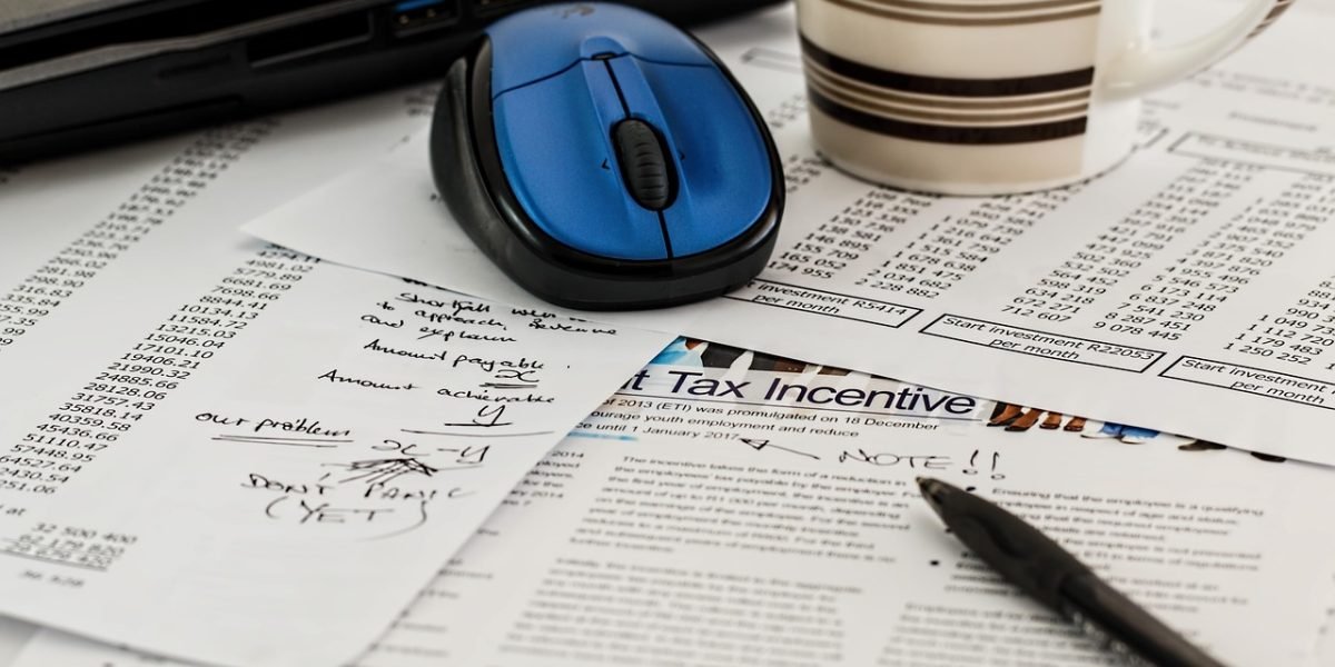 An investor meticulously calculates potential rental yields and return on investment for property options.