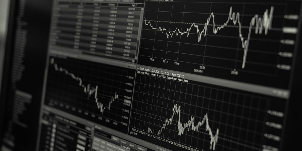 A professional analyzing market data to strategize and make informed decisions.