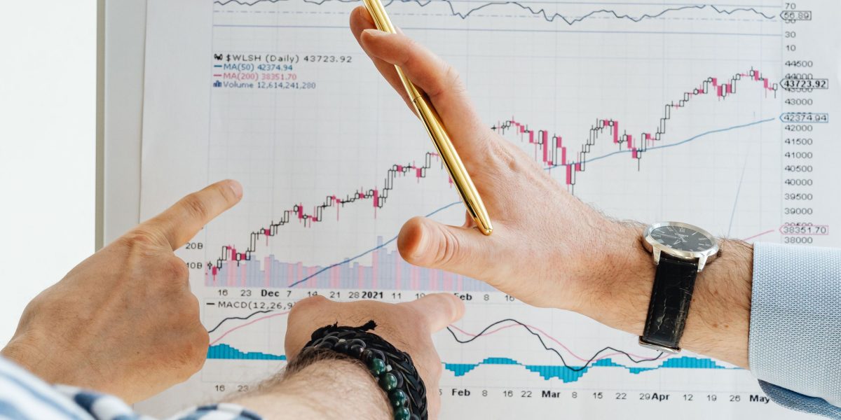 A person contemplating their investment goals, weighing the pros and cons of capital growth versus steady rental yield.