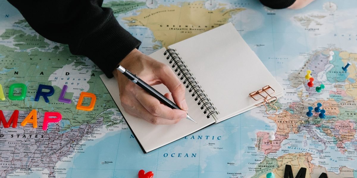 A person reviewing a map, strategizing the best locations for affordable property investments in Dubai.