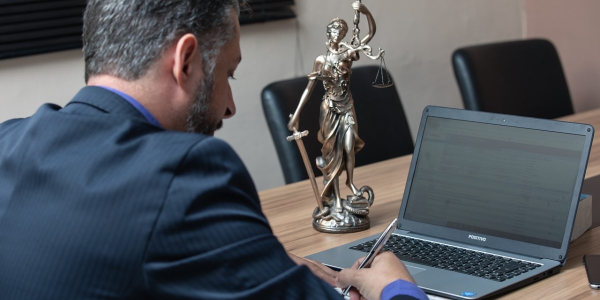 A business professional meticulously examining legal paperwork, ensuring thorough due diligence for property investment.